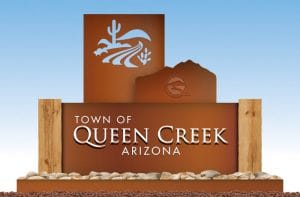 New town of qc sign